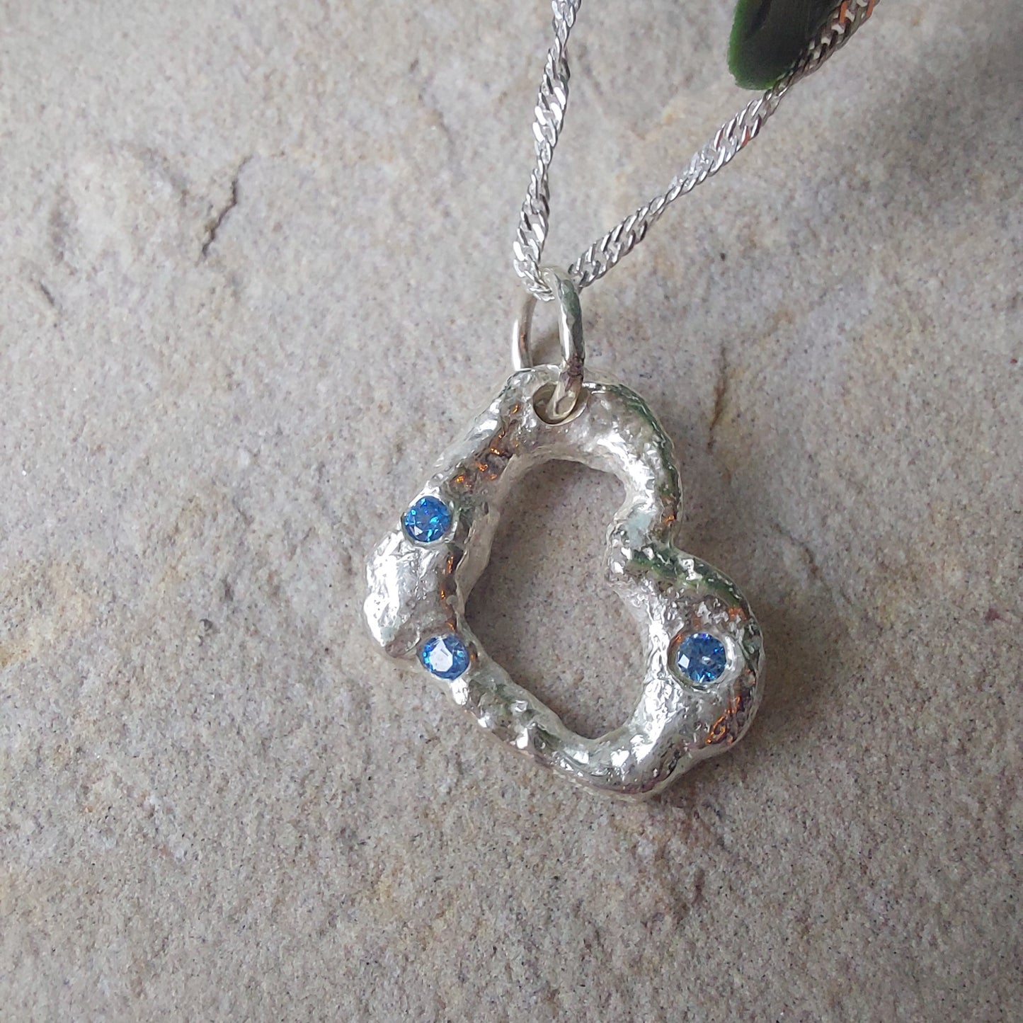 'Melt My Heart' - Molten Sterling Silver Heart Pendant with Blue CZ Sparkle.