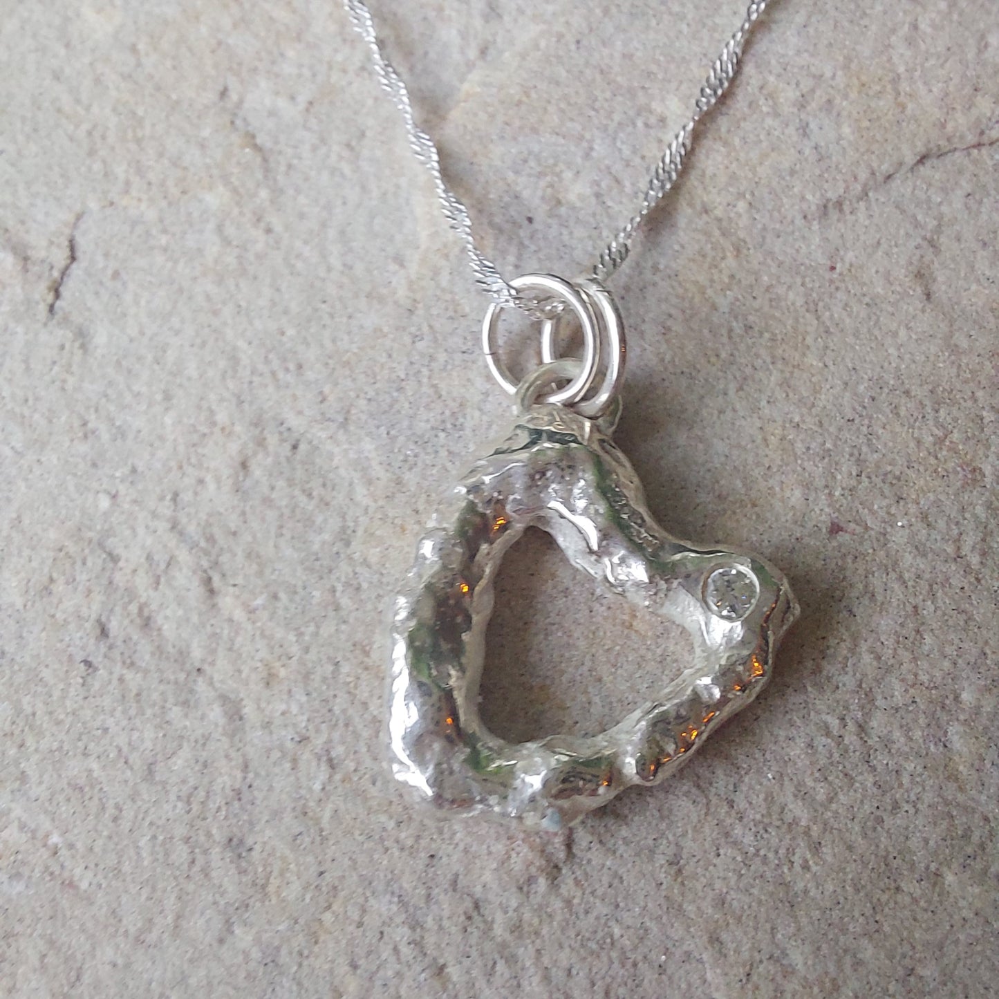 'Melt My Heart' - Molten Sterling Silver Heart Pendant with a Clear CZ Sparkle