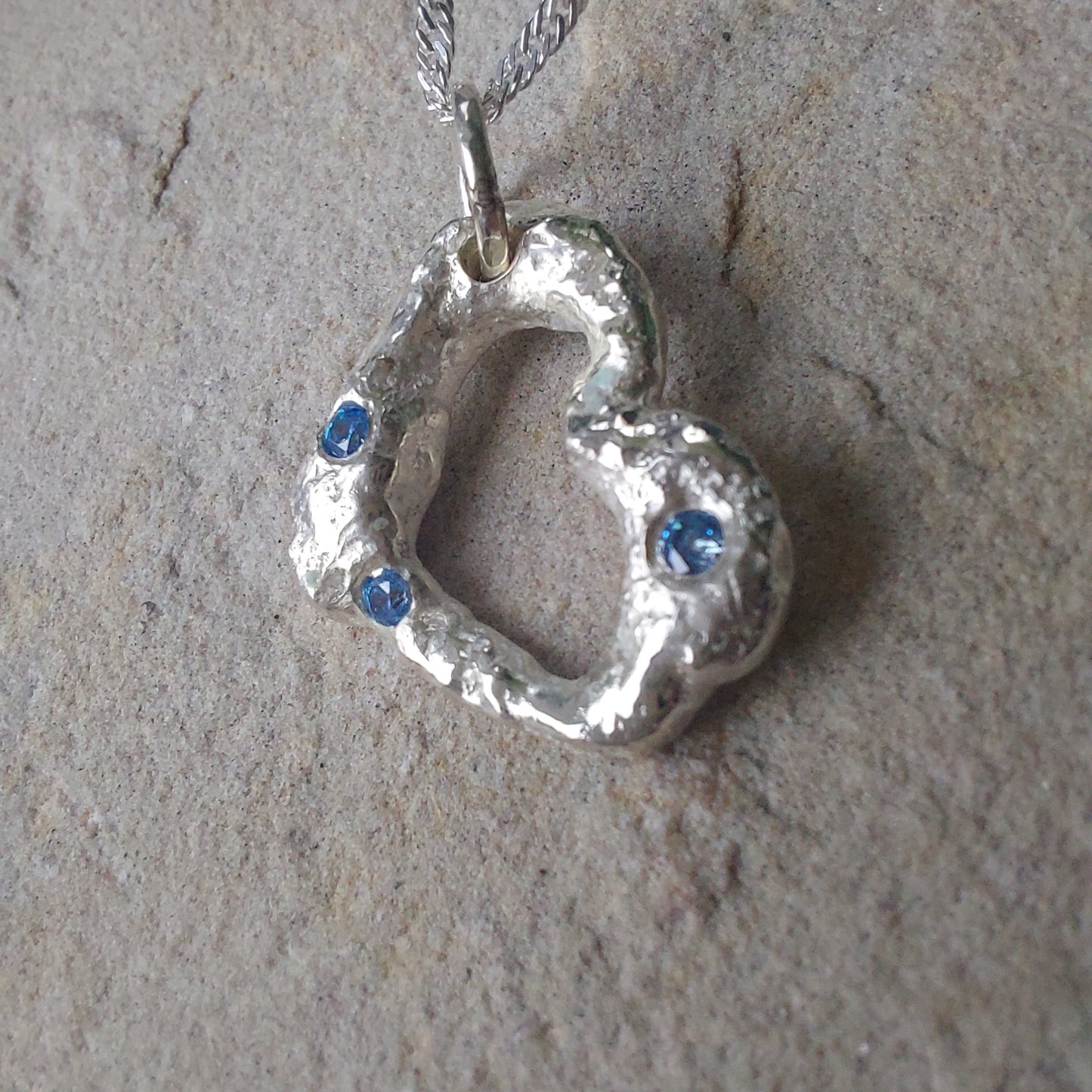 'Melt My Heart' - Molten Sterling Silver Heart Pendant with Blue CZ Sparkle.