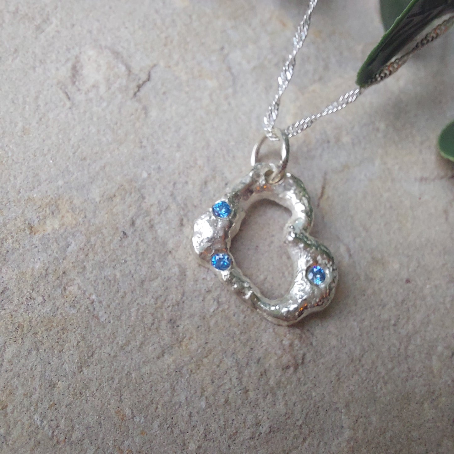'Melt My Heart' - Molten Sterling Silver Heart Pendant with Blue CZ Sparkle.