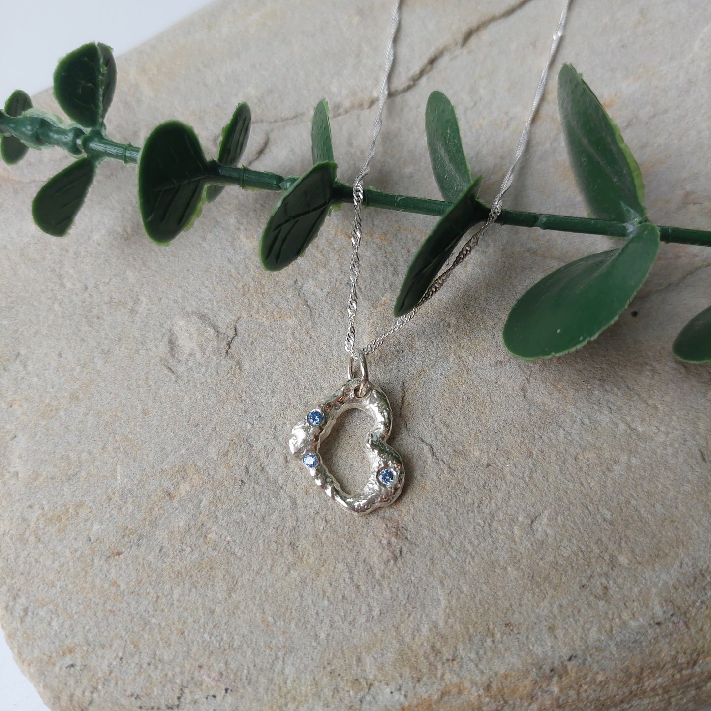 'Melt My Heart' - Molten Sterling Silver Heart Pendant with Blue CZ Sparkle.