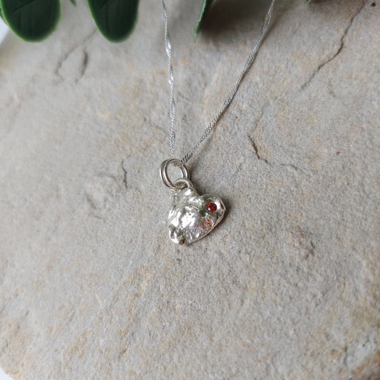 'Melt My Heart' - Molten Sterling Silver Little Heart Pendant with a Red CZ Sparkle